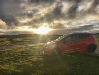 Car against sky during sunset