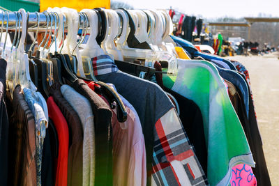 Clothes hanging on rack for sale at market