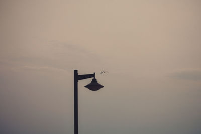 Low angle view of street light against sky