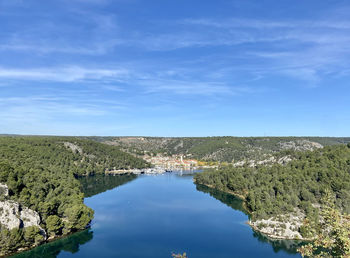 Scenic view of lake against blue sky