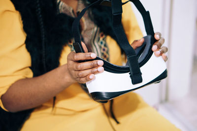 Close-up of woman holding virtual reality simulator