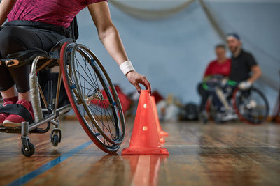 Low section of man riding bicycle on floor