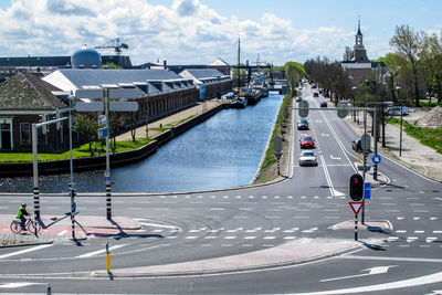 Rear view of woman on road in city