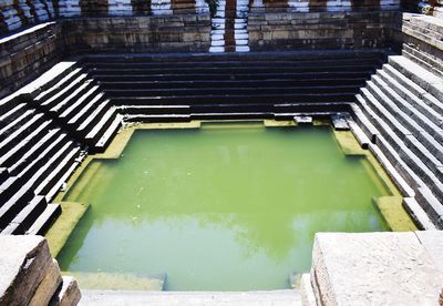 High angle view of swimming pool by building