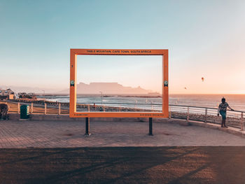 Scenic view of sea against clear sky during sunset