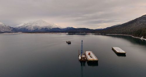 Scenic view of lake and mountains against sky