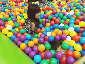 High angle view of girl playing with swimming pool