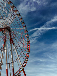 Low angle view of ferris wheel against sky