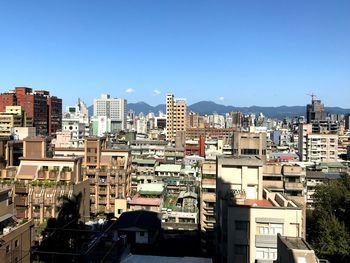 Cityscape against blue sky