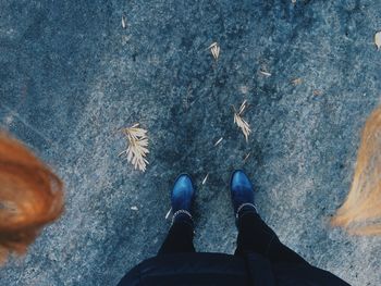 Low section of people standing on tiled floor