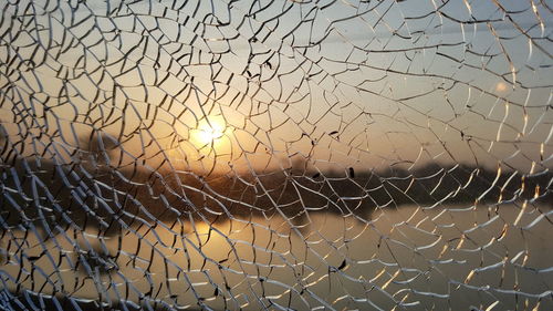 Full frame shot of chainlink fence against sky