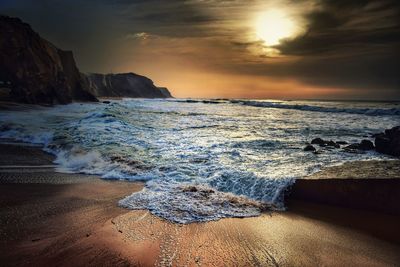 Scenic view of sea against cloudy sky