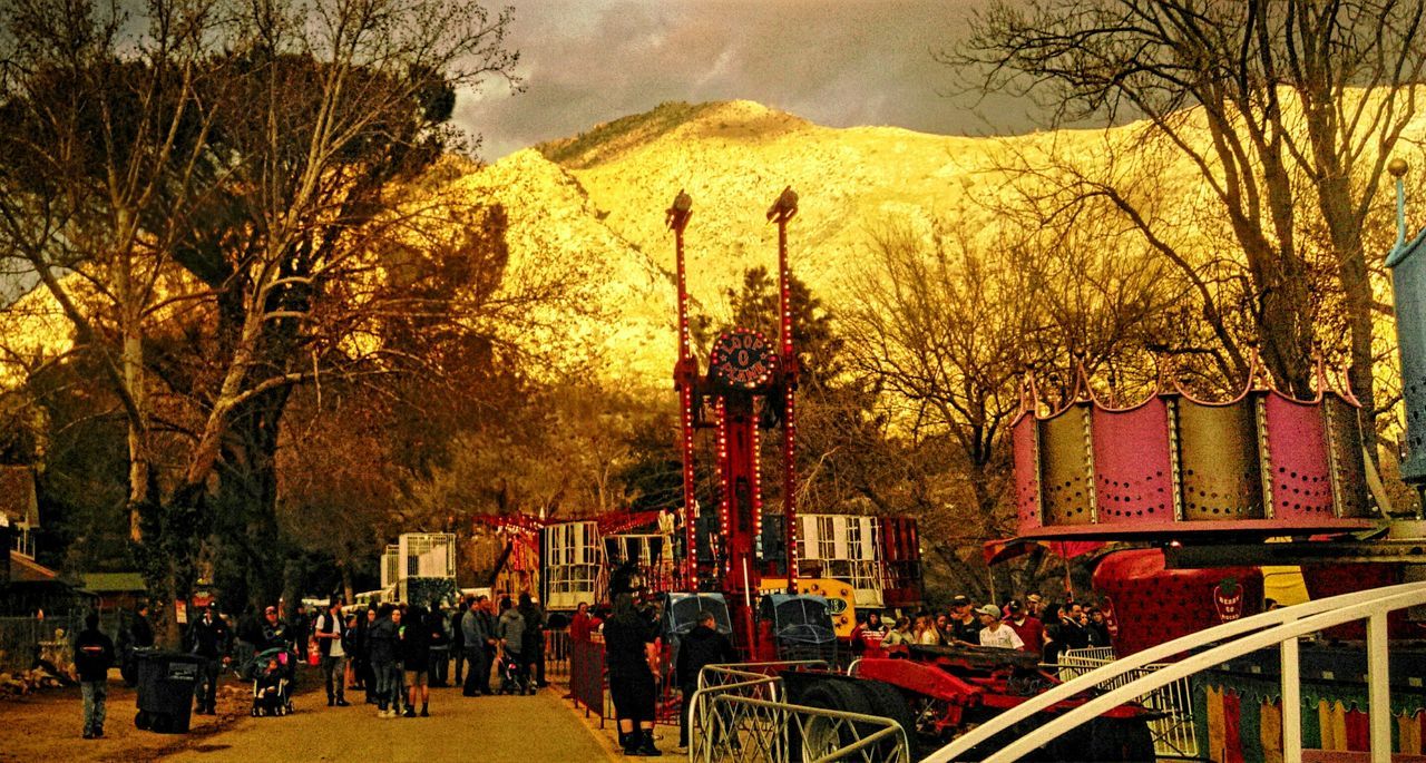 PANORAMIC VIEW OF PEOPLE AT SUNSET