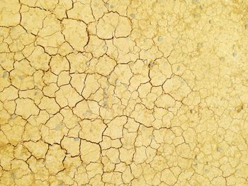 High angle view of cracked sand