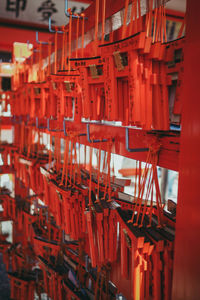 Close-up of red lanterns hanging in temple outside building