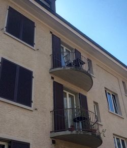 Low angle view of houses against blue sky