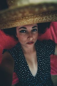 Portrait of young woman wearing hat