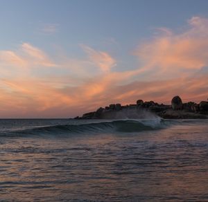Scenic view of sea against sky during sunset