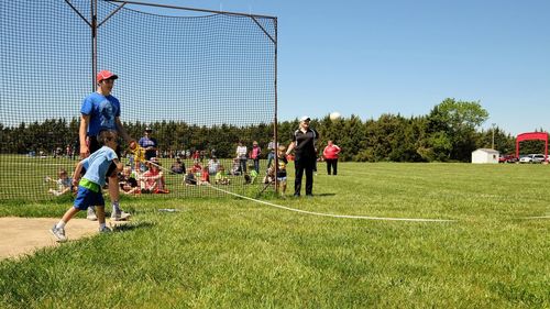 People playing soccer on field