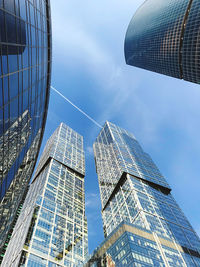 Low angle view of modern buildings against  sky  in a heart of a town