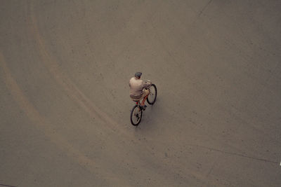 High angle view of man cycling on street