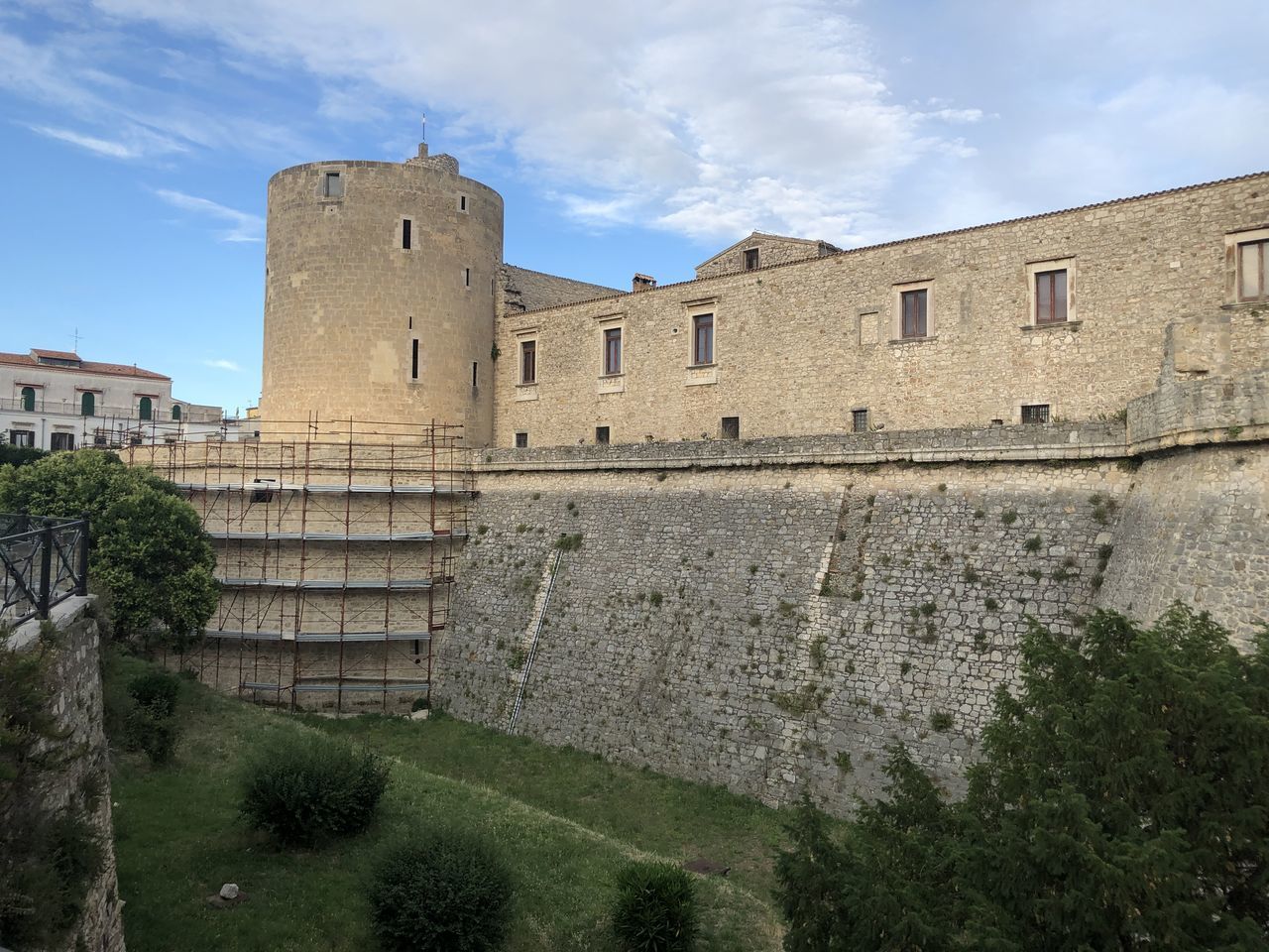 architecture, built structure, château, history, castle, building exterior, fortification, the past, building, sky, travel destinations, fort, nature, travel, wall, moat, plant, fortified wall, tree, medieval, ancient, tourism, old, historic site, ruins, cloud, no people, outdoors, wall - building feature, ancient history, surrounding wall, day, estate, stately home, city, tower, stone wall