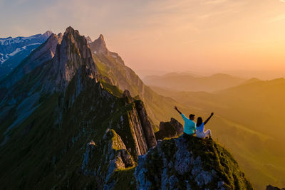 Scenic view of mountains against sky during sunset