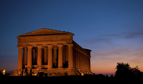 Historical building against sky during sunset