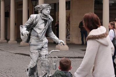 Statue of woman in city