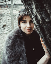 Portrait of woman standing in snow