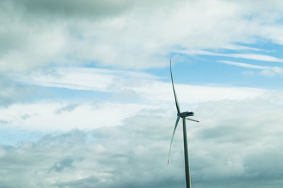 Low angle view of wind turbine against sky