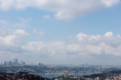 Aerial view of city against sky