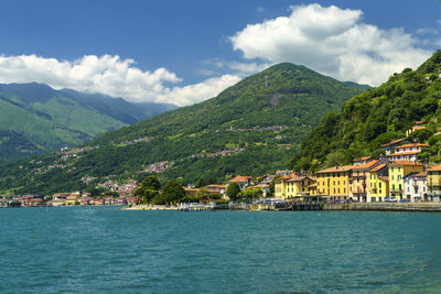 Scenic view of sea and buildings in town