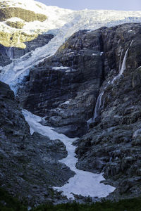 Scenic view of waterfall against sky