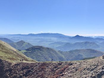 Scenic view of mountains against clear blue sky