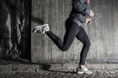 Full length of man running in tunnel