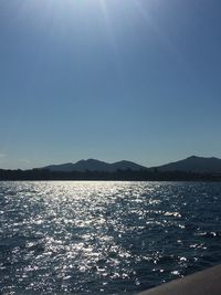 Scenic view of sea against clear blue sky