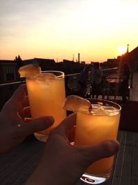Cropped image of hand holding drink