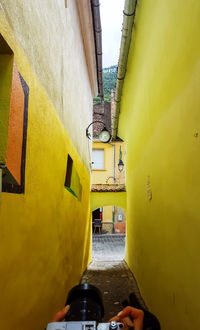 Narrow alley amidst buildings in city