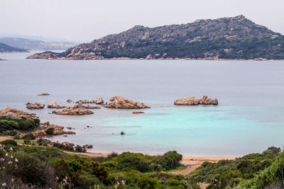 Scenic view of sea against mountain