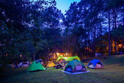 Tent in park against sky at night