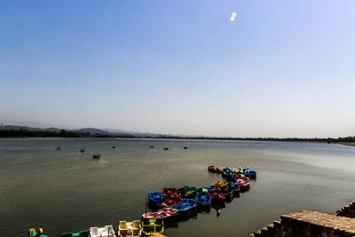 Scenic view of sea against sky in city