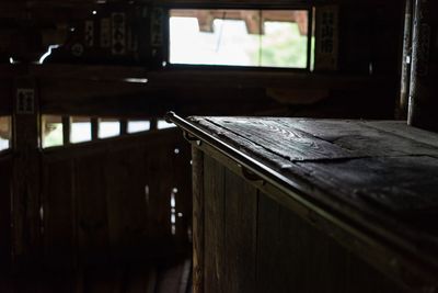 Empty wooden table in old house