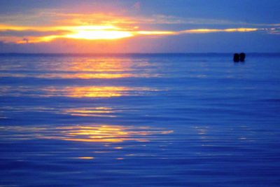 Scenic view of sea at sunset