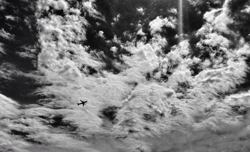 Low angle view of people against sky