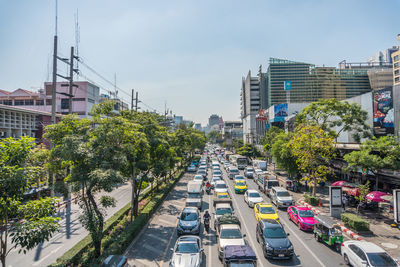 High angle view of city street and buildings against sky