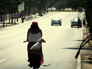 Woman standing on city street
