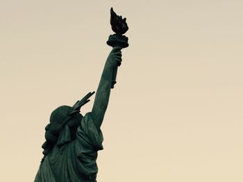 Low angle view of statue against clear sky