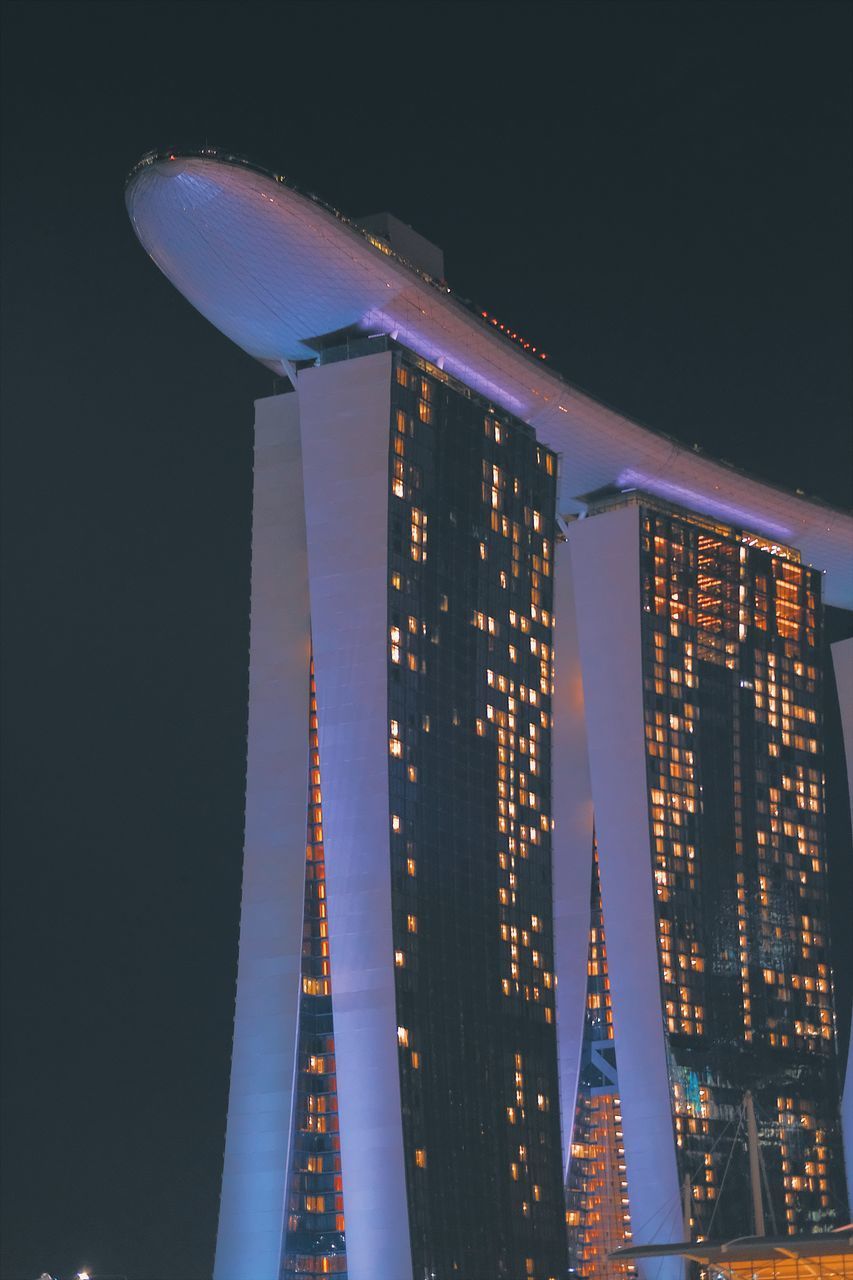 LOW ANGLE VIEW OF ILLUMINATED BUILDINGS AGAINST SKY