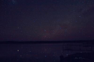 Scenic view of star field against sky at night